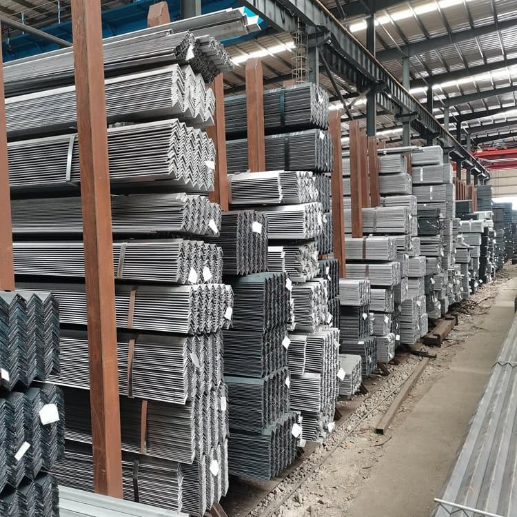 Stacks of bundled steel angle bars organized on racks in a large industrial storage facility.